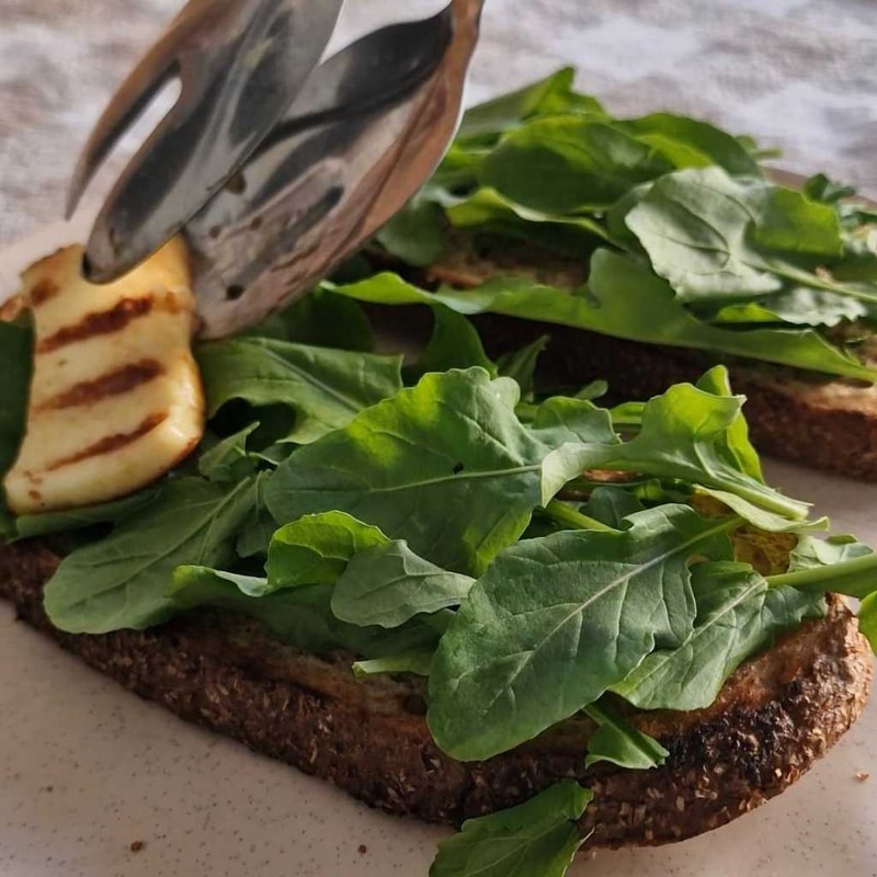 adding halloumi to the toast