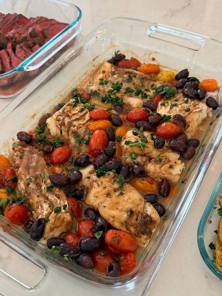 large glass dish filled with a variety of vegetables and meat