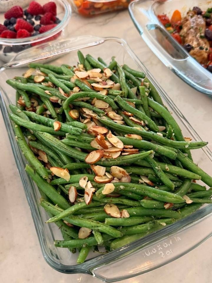 glass dish filled with green beans and almonds