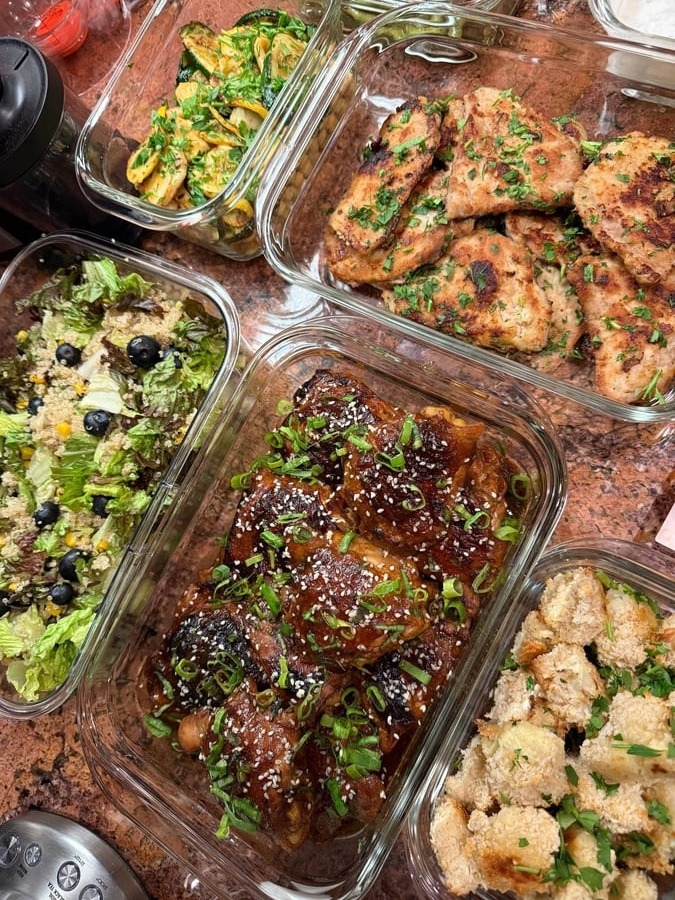Lacquered soy-free teriyaki chicken thighs under sesame seeds and scallions, panko cauliflower crowding the frame.