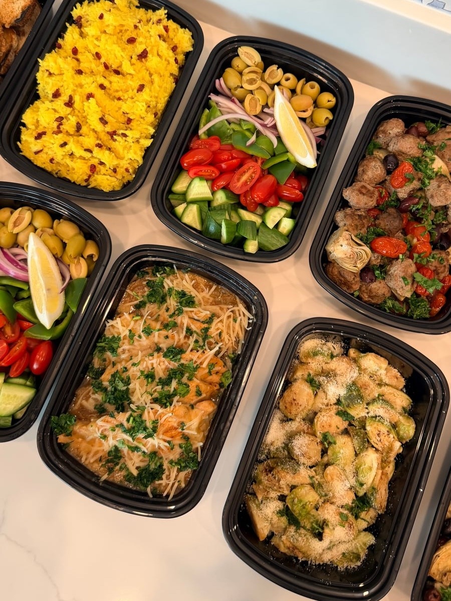 This variety of dishes features French onion chicken,Greek beef meatballs, saffron rice, roasted Brussels sprouts, and Greek salad.