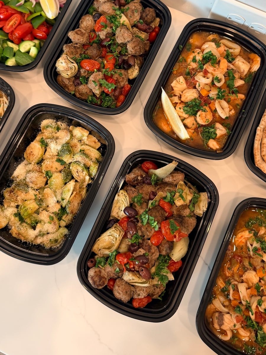 This assortment features savory Greek lean beef meatballs tossed with artichoke hearts and olives alongside a rich, fragrant Cioppino seafood stew.