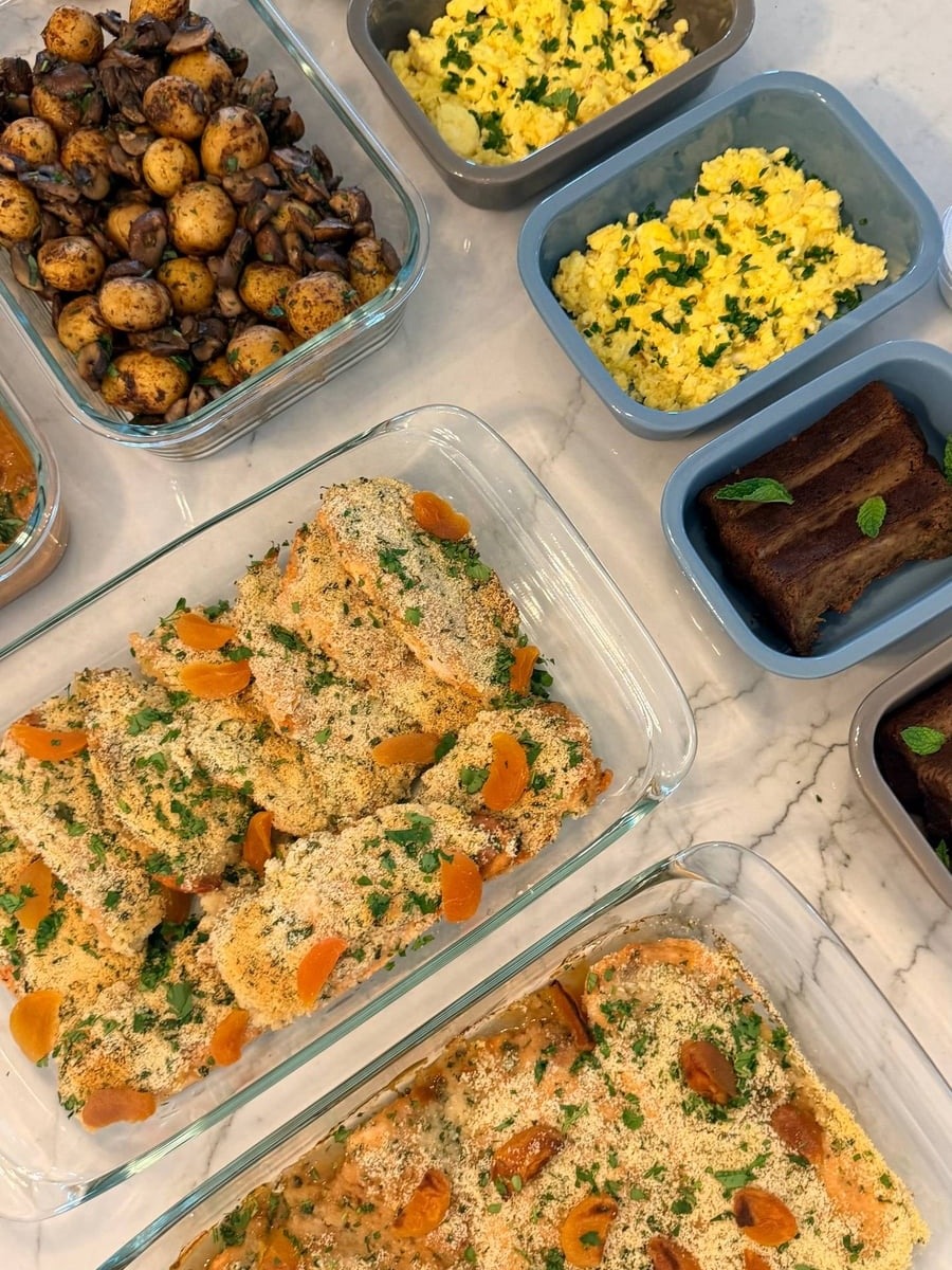 Dried apricot halves tuck into a herbed crumb over baked chicken breasts, scrambled eggs alongside.
