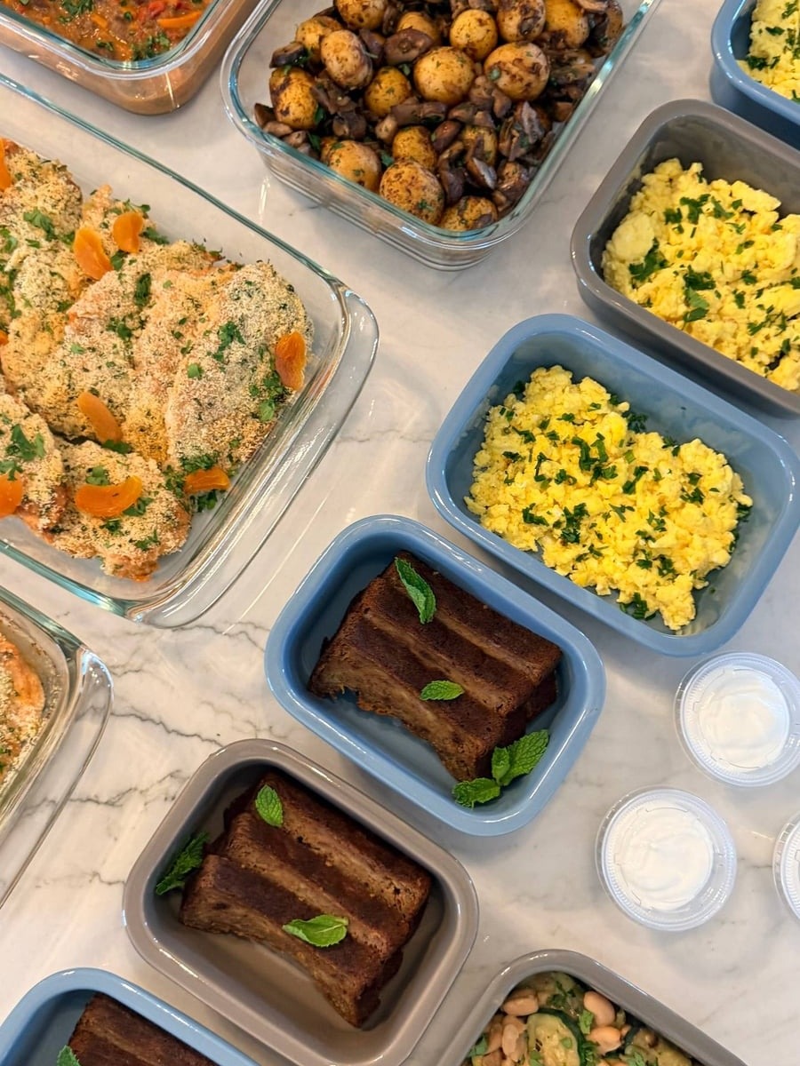 Mint leaves top thick slices of protein banana bread, set beside chive scrambled eggs and mushroom potatoes.