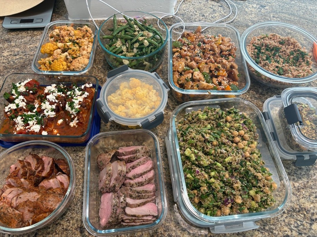 Overhead view of various meal prep dishes in glass containers