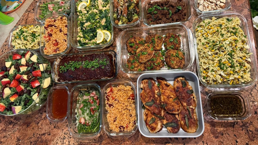 Sage-topped saltimbocca and a dark-glazed meatloaf anchor the whole delivery, kale salad off to one side.