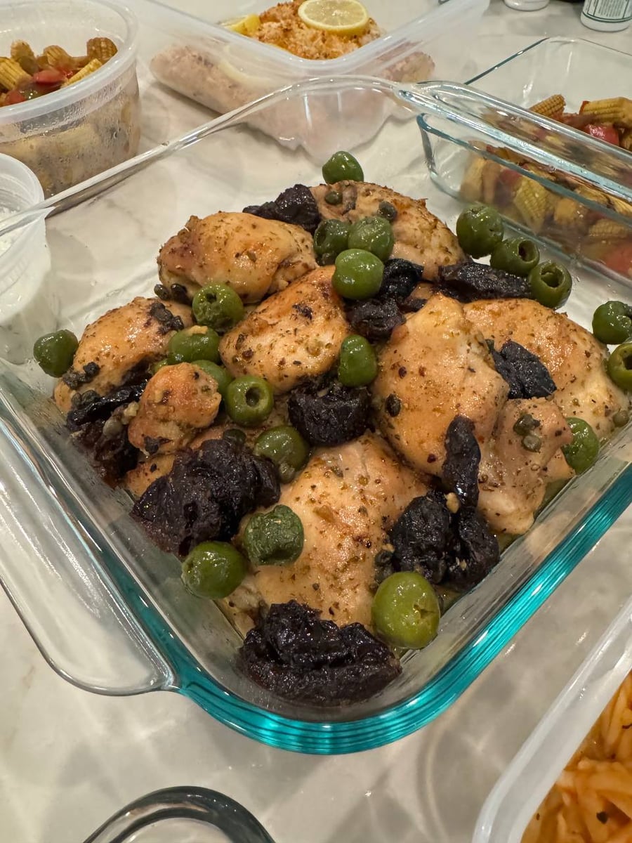 Prunes collapse between the marbella chicken thighs, green olives and capers scattered across the top.