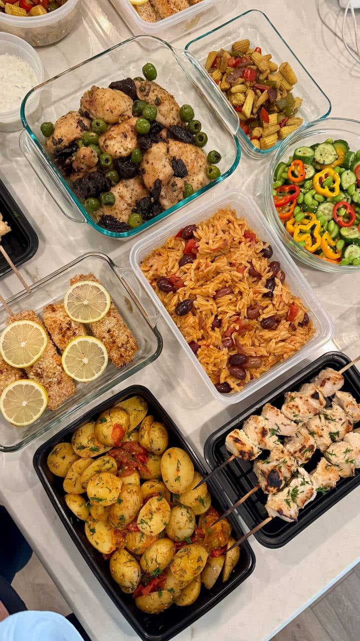 Kalamata olives run through the creamy tomato parmesan orzo, marbella chicken and lemon topped salmon alongside.