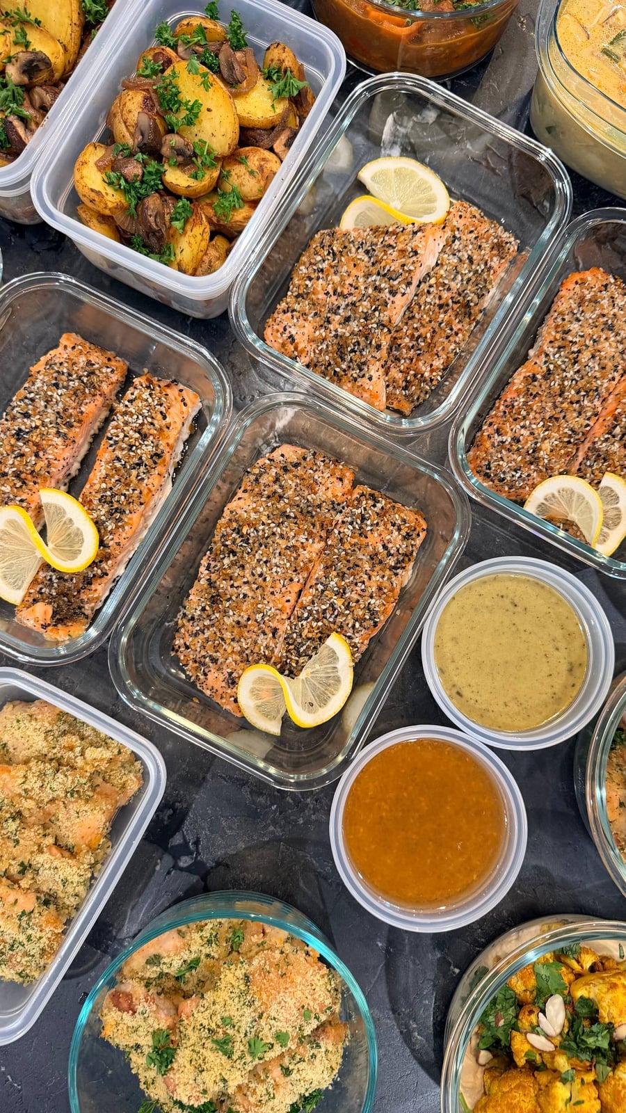 Browned mushrooms wedge between the roasted baby potatoes, seed crusted salmon lined up beside them.