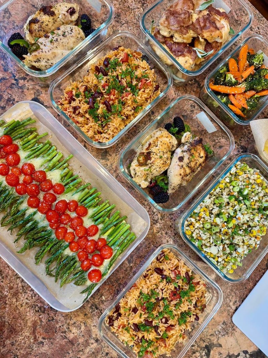 Two blackberry-stuffed breasts sit between Spanish rice, saltimbocca, sesame broccoli and corn couscous.