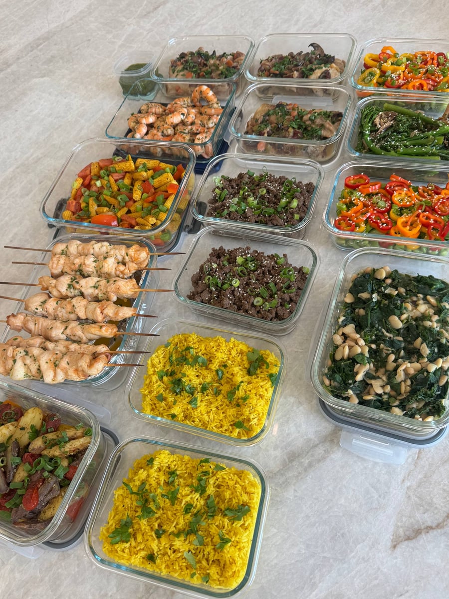 Garlic Parmesan chicken skewers cross turmeric rice beside Korean beef, shrimp, coq au vin, spinach beans and vegetables.