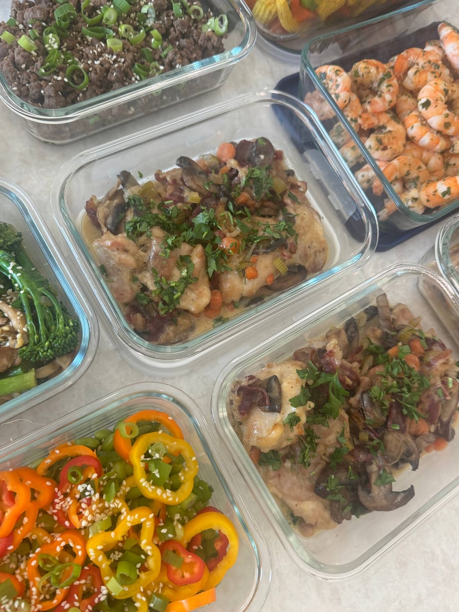 Mushrooms, carrots and bacon cover coq au vin chicken beside chimuchuri shrimp, Korean beef and sesame broccolini.