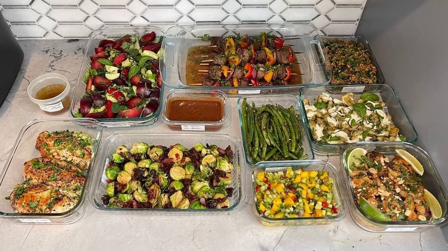 American plates with a cheese and broccoli stuffed chicken, beef kebobs and a plum basil salad