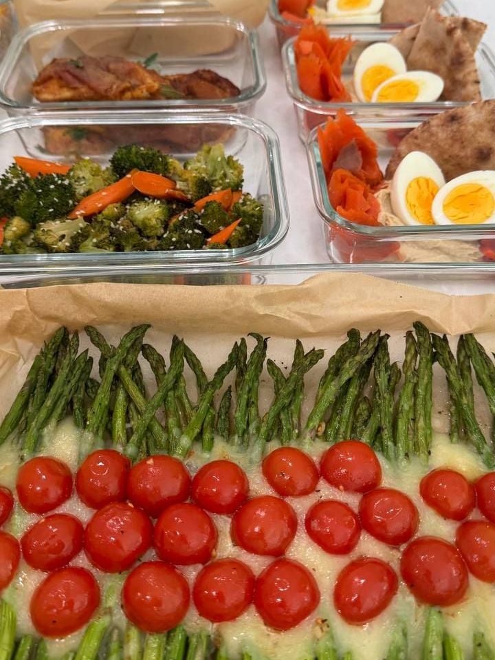 Carrot batons cut through the sesame roasted broccoli, saltimboka visible just past them.