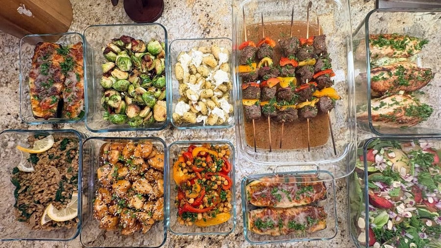 Nine dishes surround beef sirloin kebabs and stuffed chicken roulades, including plum salad, farro and zucchini boats.