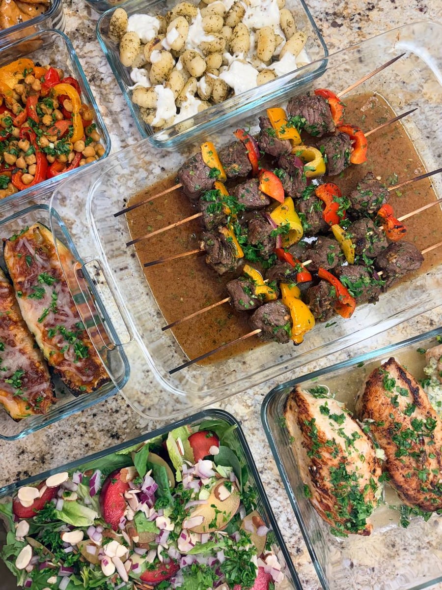 Sirloin kebabs sit between stuffed zucchini boats, chicken roulades, burrata gnocchi and plum salad with sliced almonds.