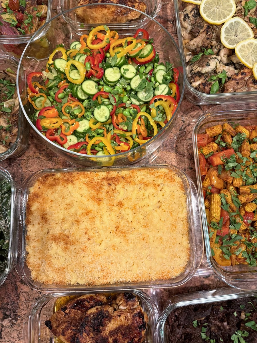 Burnished breadcrumb crust covers mac and cheese beneath edamame salad, lemon chicken, baby corn and shredded chuck roast.