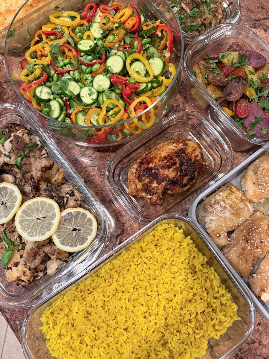 Sesame-speckled miso cod and garlic chicken border turmeric rice, lemon thighs, roasted potatoes and edamame salad.