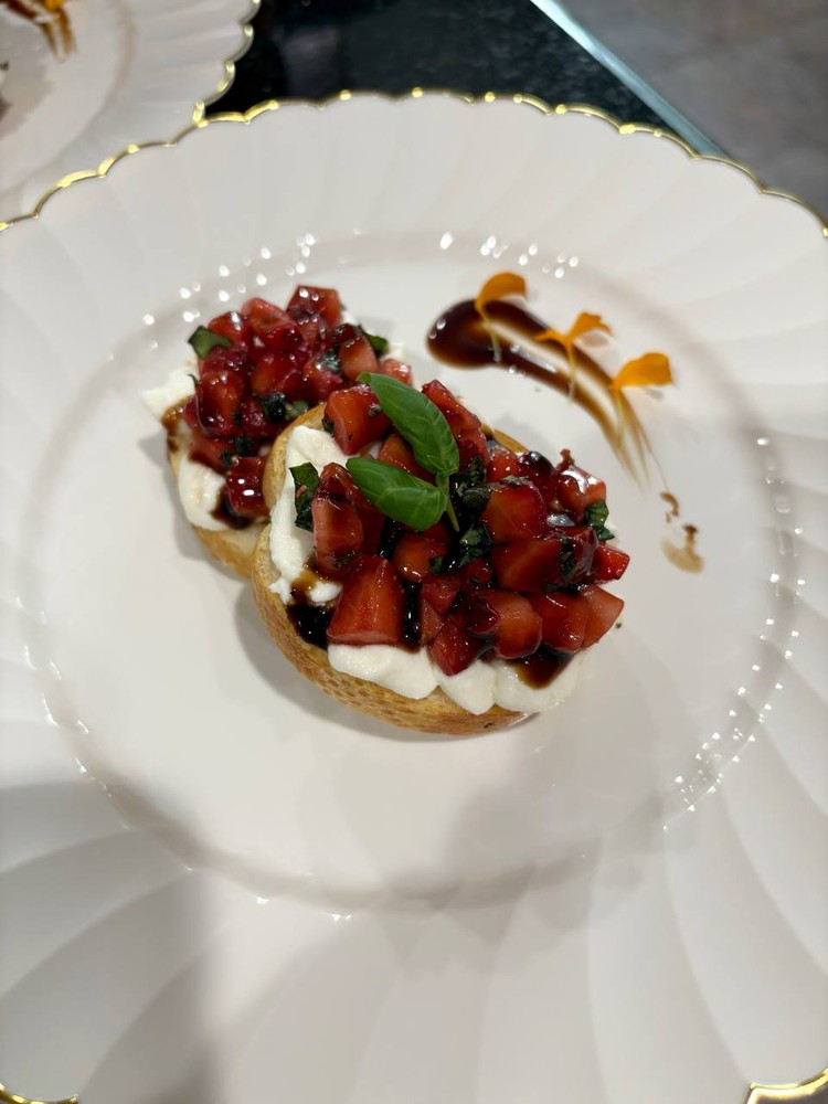 Strawberry balsamic bruschetta with basil and balsamic glaze.