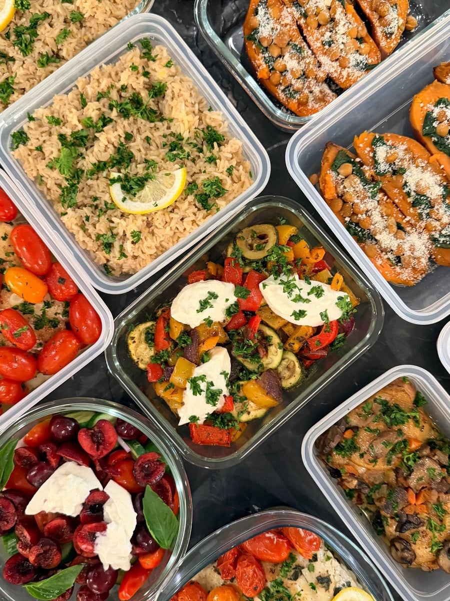Chickpeas and spinach-stuffed sweet potatoes border roasted zucchini, lemon brown rice, cod and cherry panzanella.