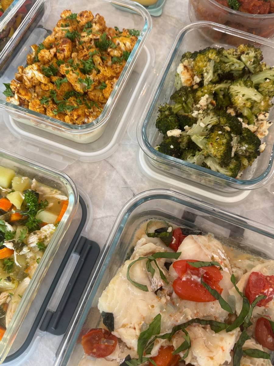 Moroccan-spiced cauliflower and feta broccoli border tomato lemon cod with basil, blistered tomatoes and pale cooking juices.