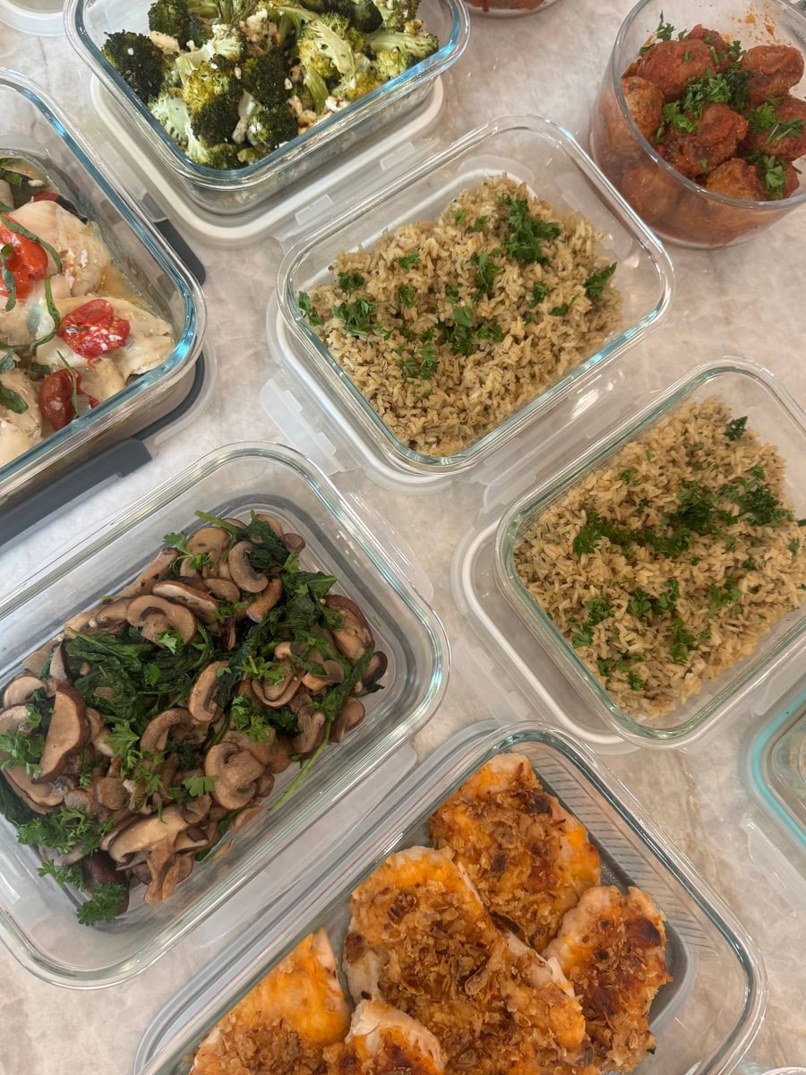Sauteed mushrooms and spinach fill one dish beside parsleyed brown rice, honey mustard chicken, broccoli and meatballs.