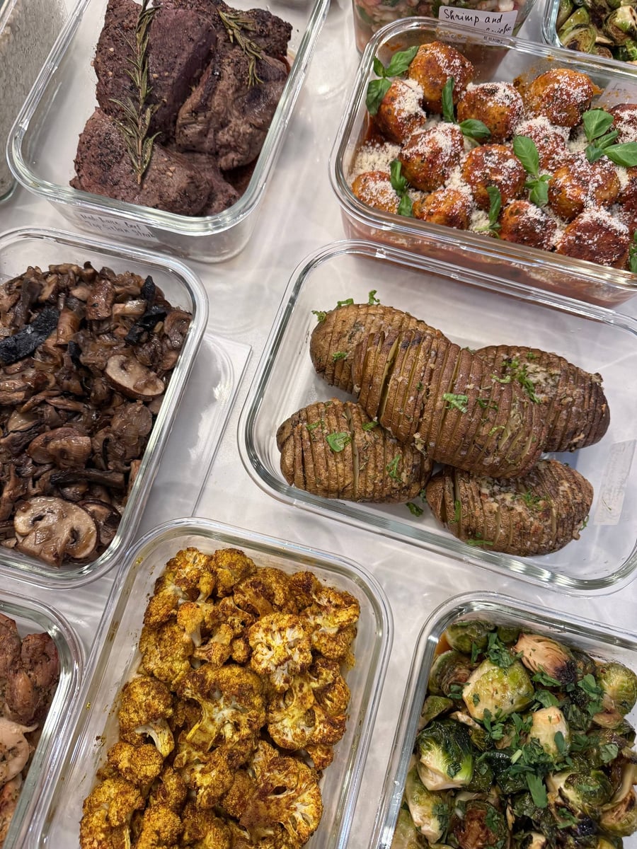 Basil leaves dot tomato-coated turkey meatballs beside Hasselback potatoes, spiced cauliflower and rosemary sirloin.
