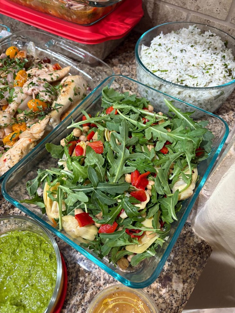 Arugula and chickpea salad with roasted red peppers and artichoke hearts.