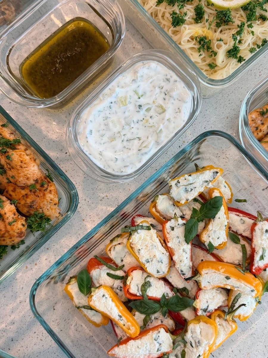 Turkey tenderloin sliced thin beside cajun-rubbed chicken strips, parsley scattered across both dishes.