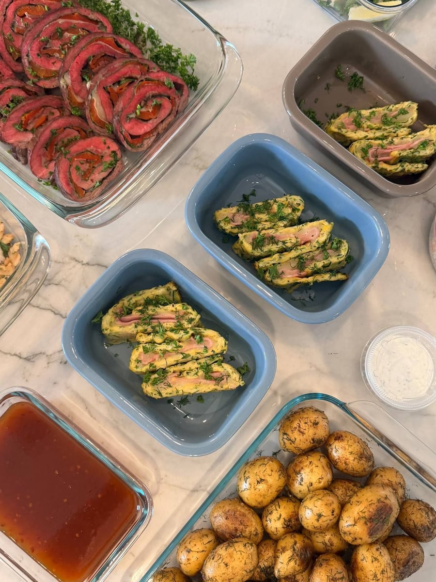 Dill clings to seared baby potatoes, with sweet chili sauce and ham-filled zucchini egg wraps above.
