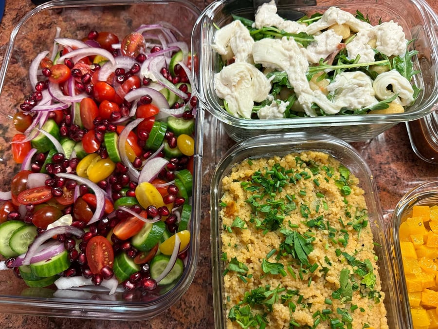 Torn white cheese drapes over gnocchi and arugula, pomegranate salad and herbed couscous alongside.