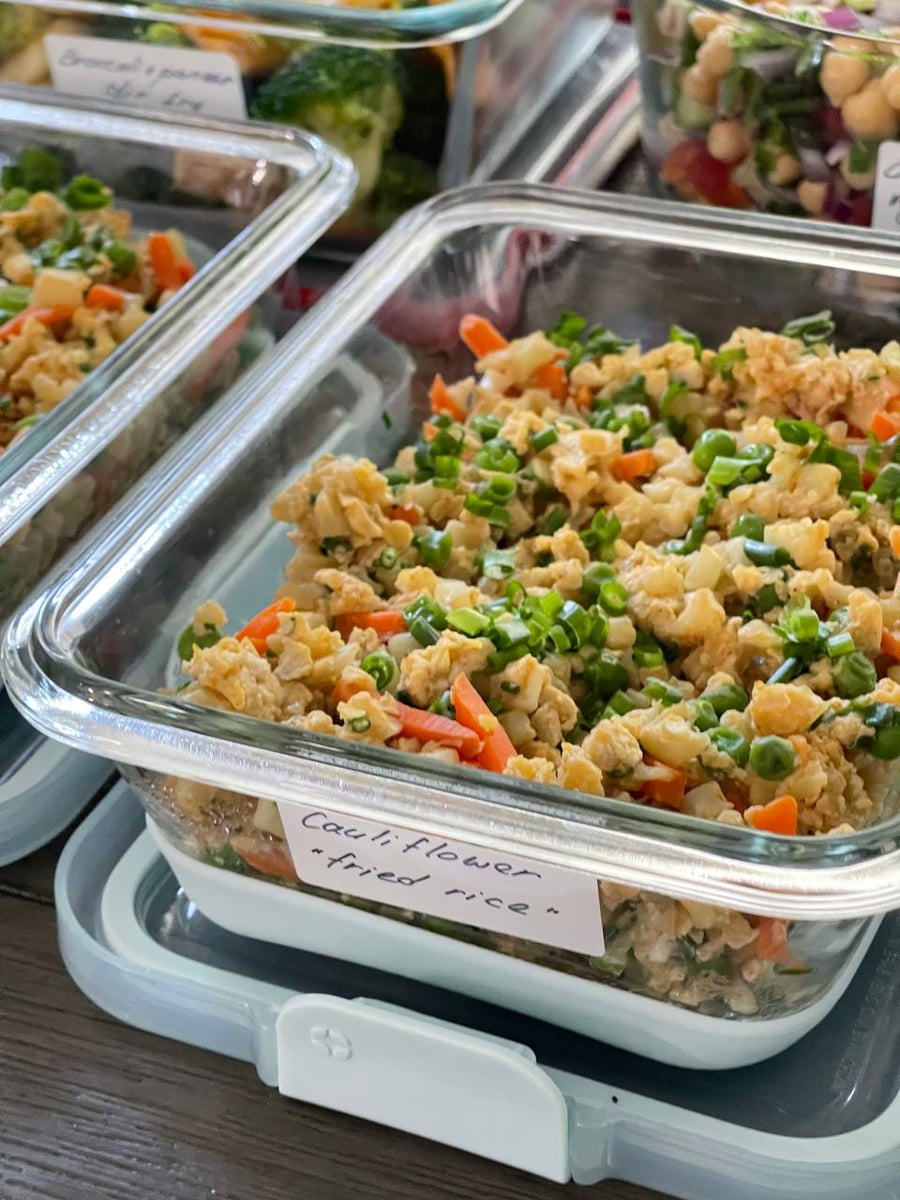 Riced cauliflower tossed with sliced carrot, peas, scrambled egg and a thick scatter of green spring onion.
