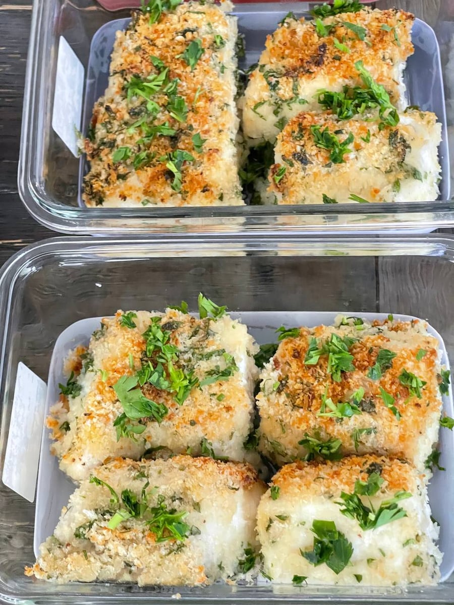 Panko and herbs bake into a rough gold crust over white halibut, fresh parsley torn over the top.