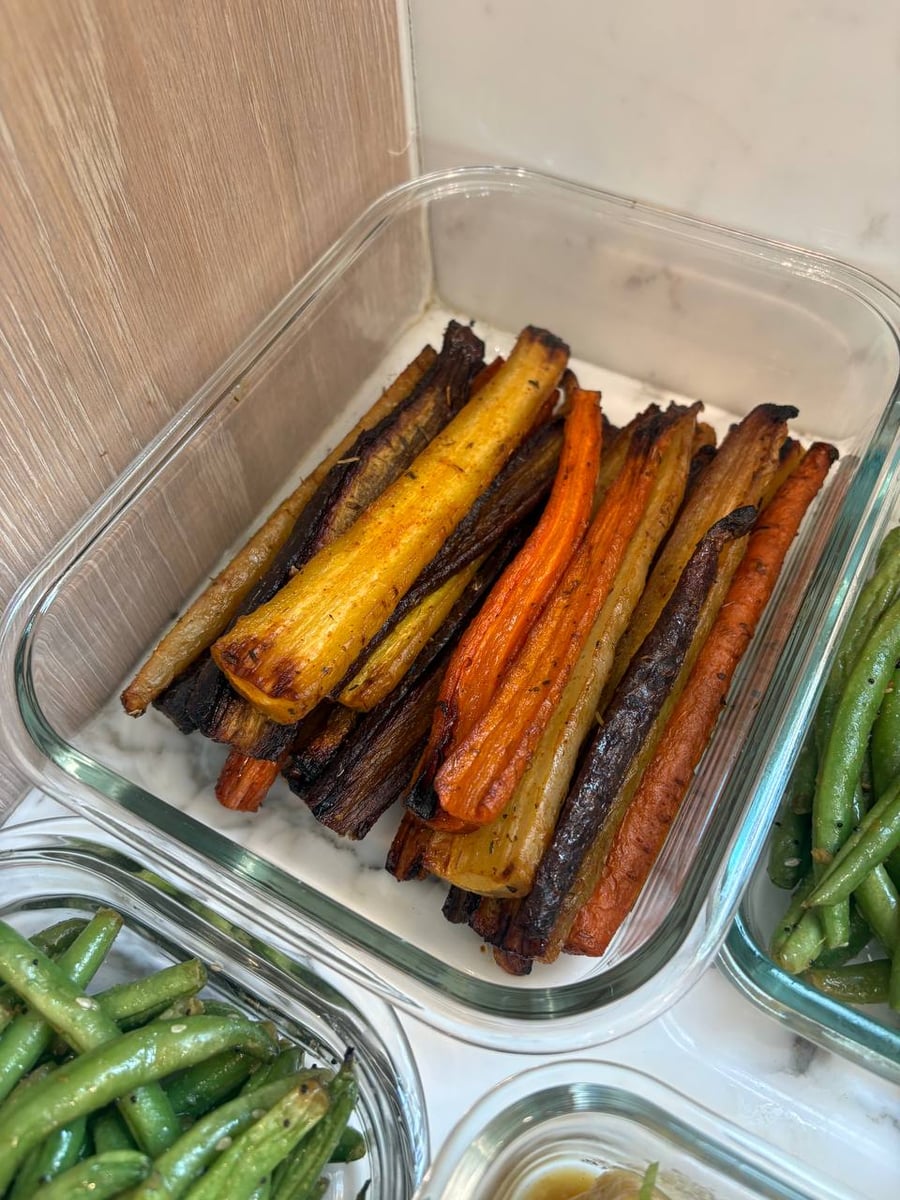 Long parsnip and carrot batons darken at the tips, sesame green beans crowding in from both sides.