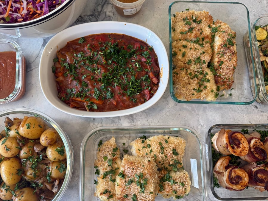 Beef chakhohbili stew glows dark red under chopped herbs beside panko halibut and mushroom baby potatoes.