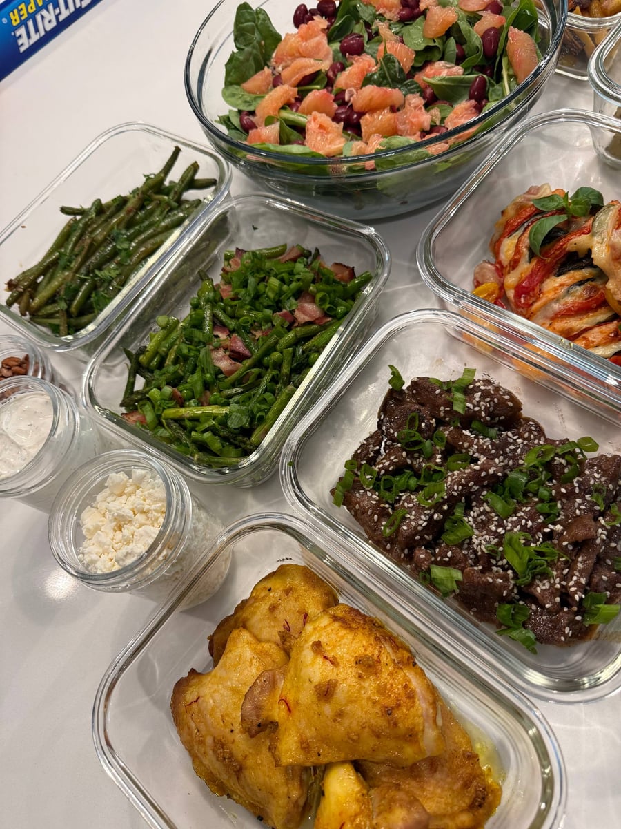 Saffron threads still show in the turmeric chicken thighs, asparagus and glazed beef sirloin crowding behind.
