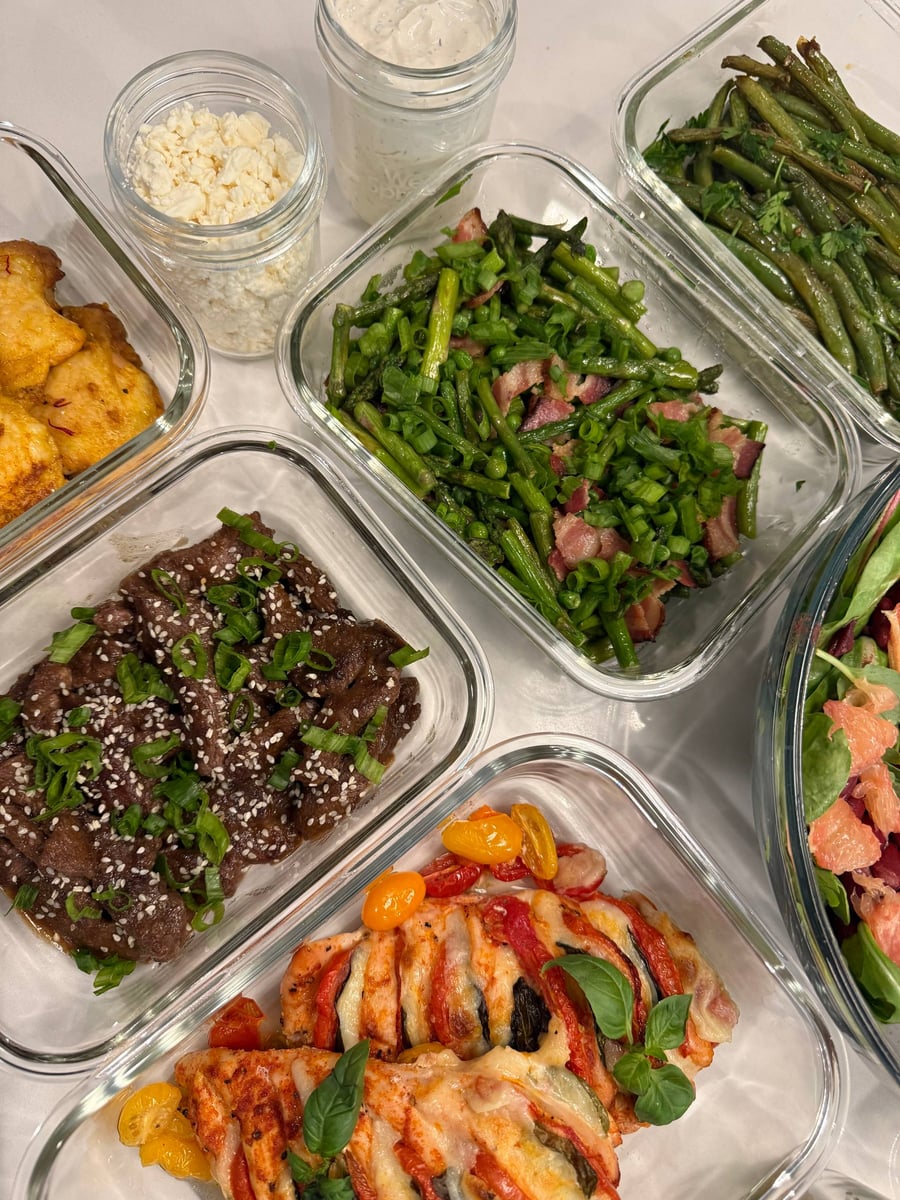 Scallion coins and sesame cover the teriyaki beef sirloin strips, feta and ranch waiting in their own jars.
