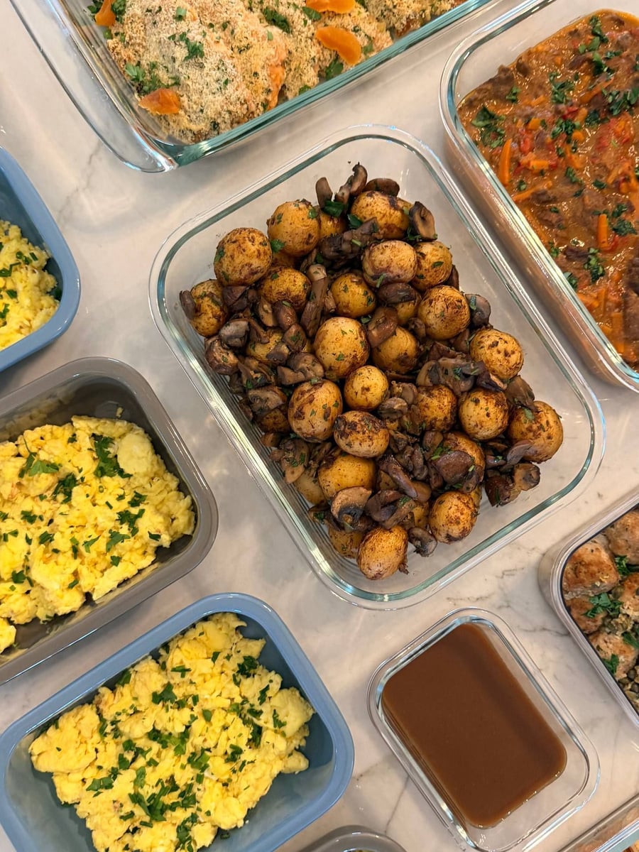 Browned mushrooms fold through baked baby potatoes, herb flecked, with chakhohbili stew and eggs around them.