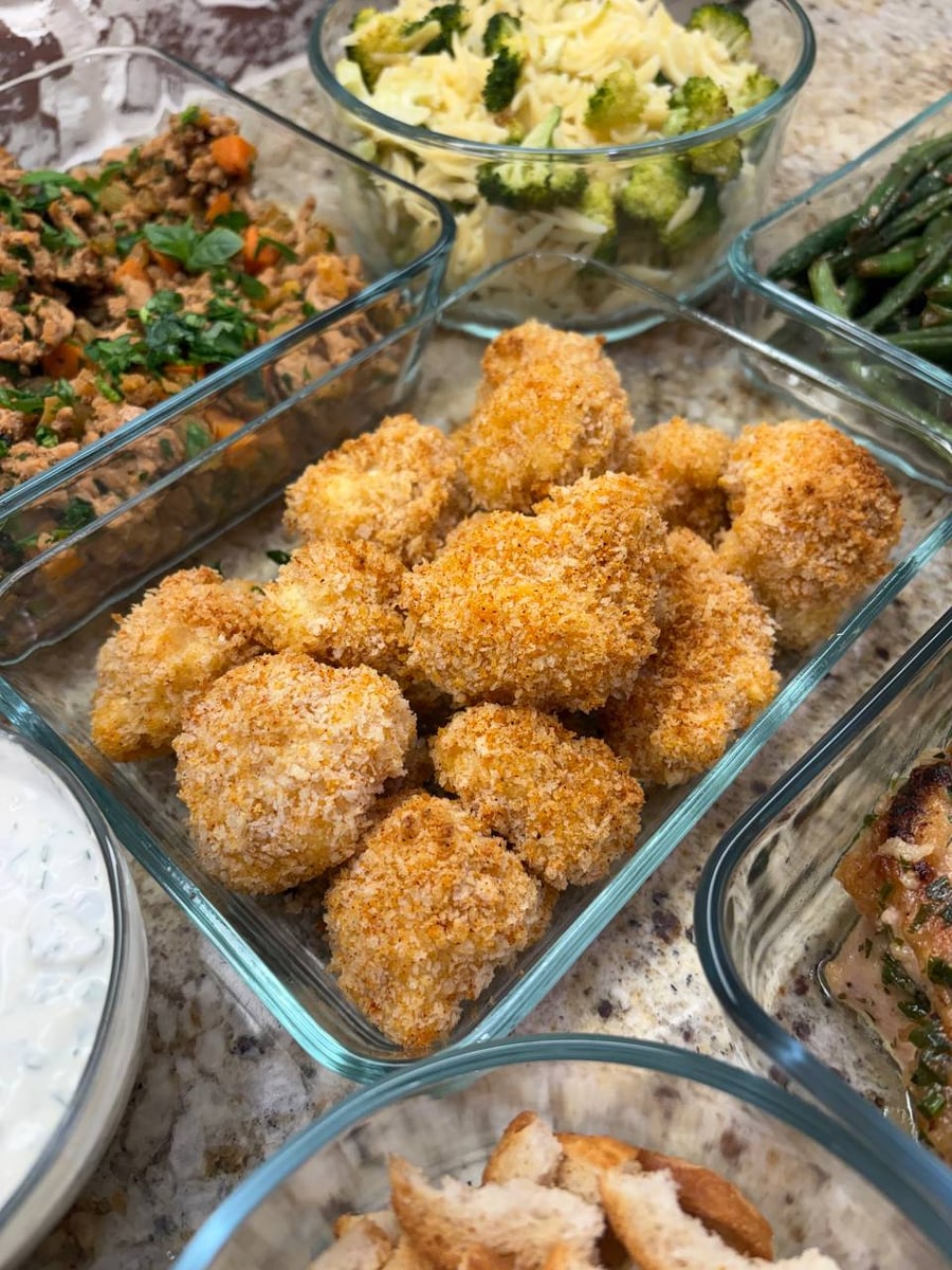 Panko cauliflower baked to a rough gold, orzo with broccoli in the bowl above and green beans right.
