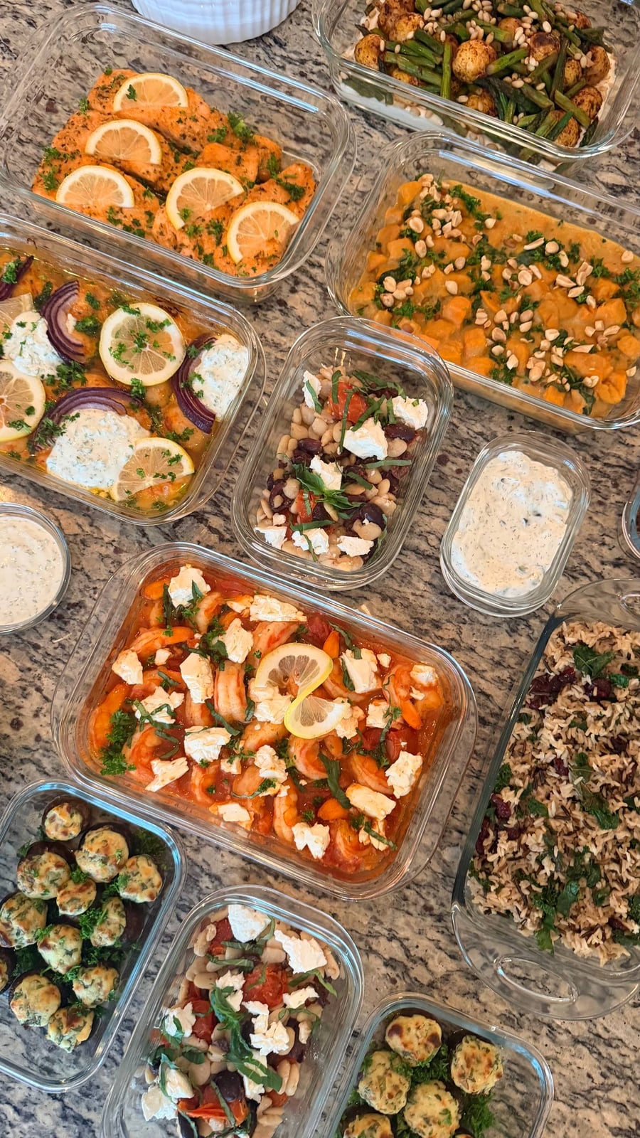 Lemon wheels line the honey garlic salmon while shrimp saganaki, wild rice and stuffed mushrooms fill the counter.