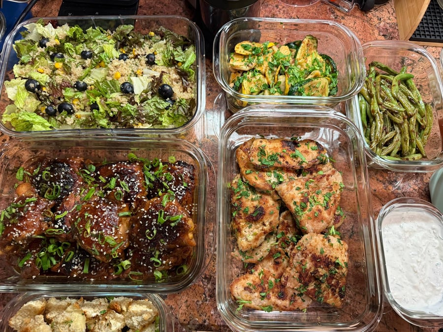 Charred corn kernels and blueberries dot the quinoa romaine salad, teriyaki thighs and herbed pork chops alongside.
