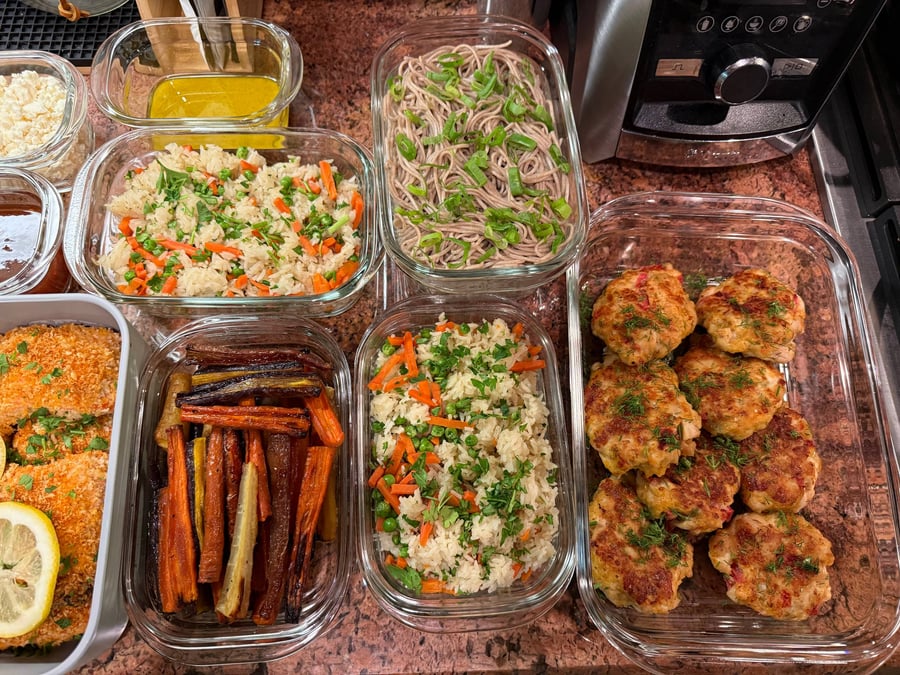 Dill-flecked chicken patties sit beside basmati rice with peas and carrots, soba noodles coiled under scallions.