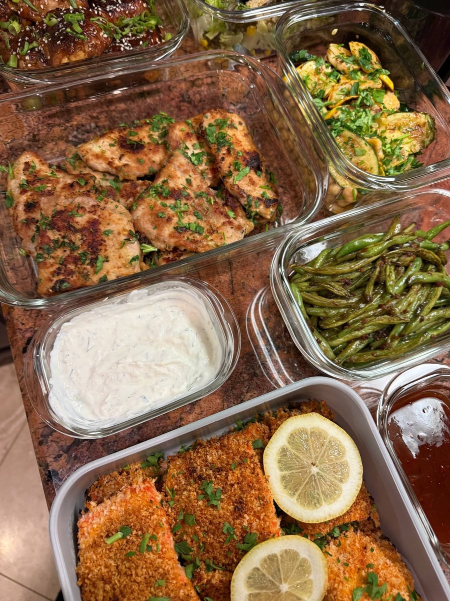 Seared pork chops scattered with parsley next to sesame green beans and a thick dill yogurt horseradish dip.