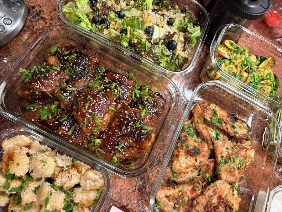 Lacquered soy-free teriyaki chicken thighs under sesame seeds and scallions, panko cauliflower crowding the frame.