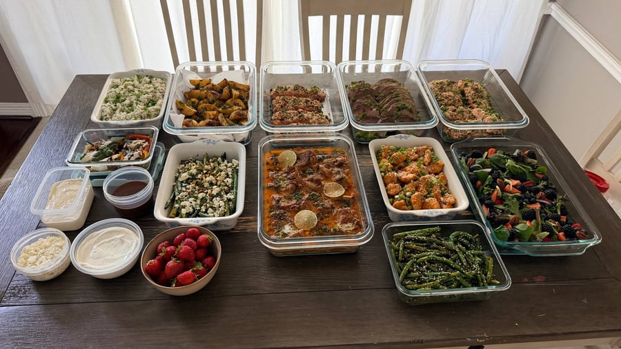 Rosemary roast beef and pecan crusted salmon beside Thai coconut chicken and a berry pecan salad