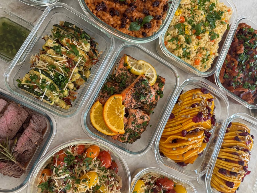 Sun-dried tomatoes darken the lemon basil farro, couscous and turkey chili lined up along its right.