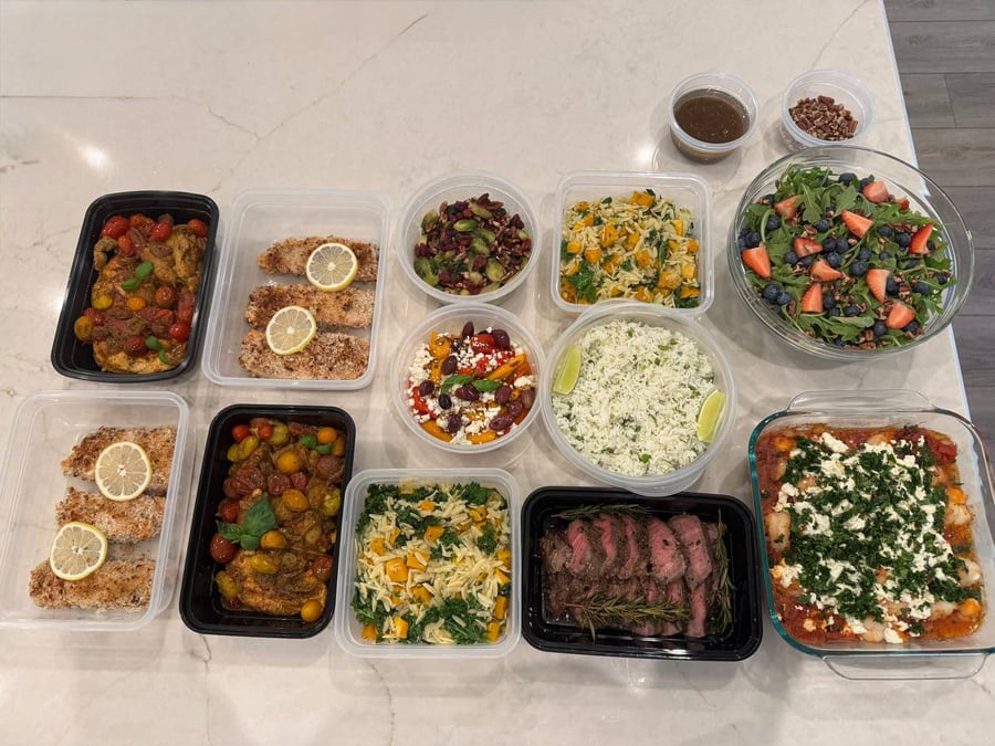 Feta and parsley cover the shrimp saganaki at one end, pesto chicken and pecan salmon at the other.