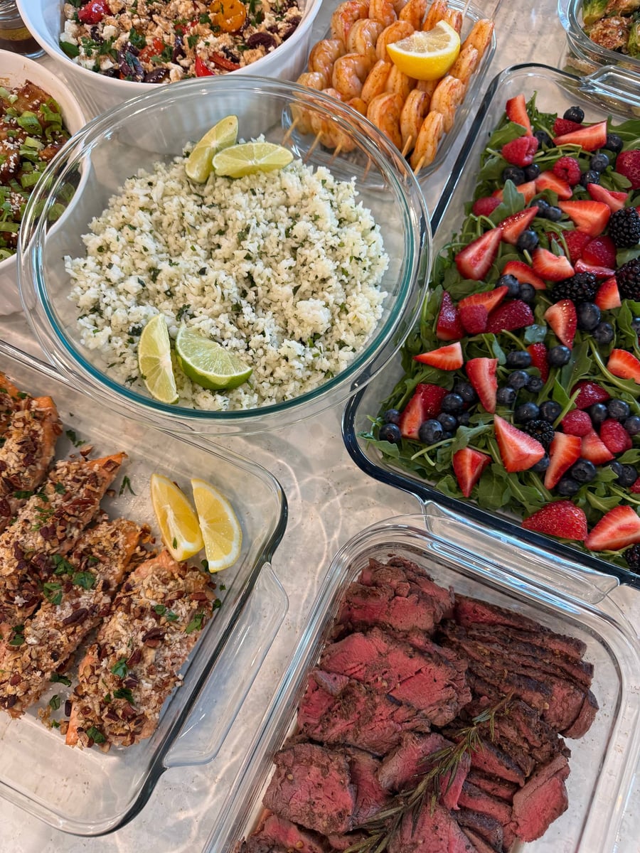 Lime wedges press into cilantro basmati rice, feta, shrimp skewers and butternut orzo around the bowl.