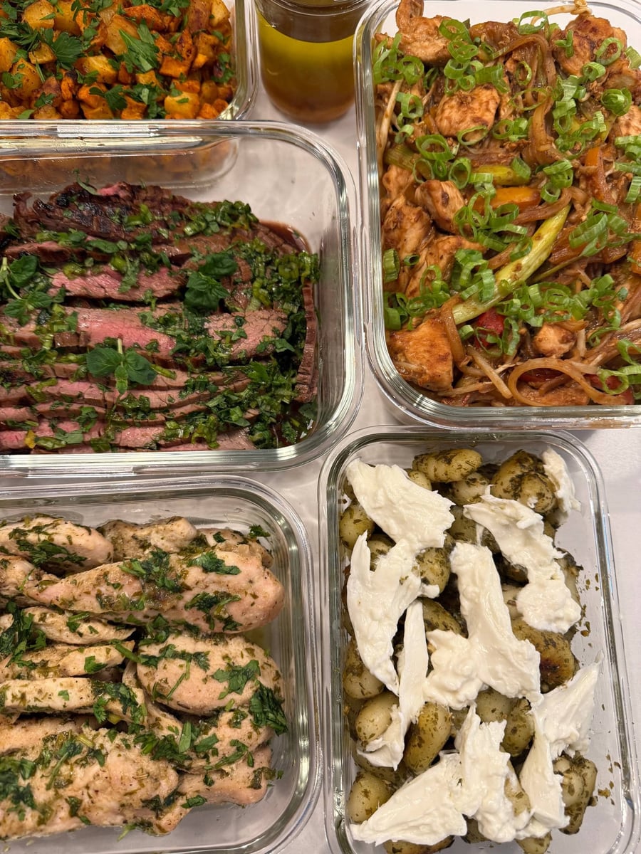Torn burrata sits on the pesto gnocchi beside scallion topped pad thai and sliced flank steak.