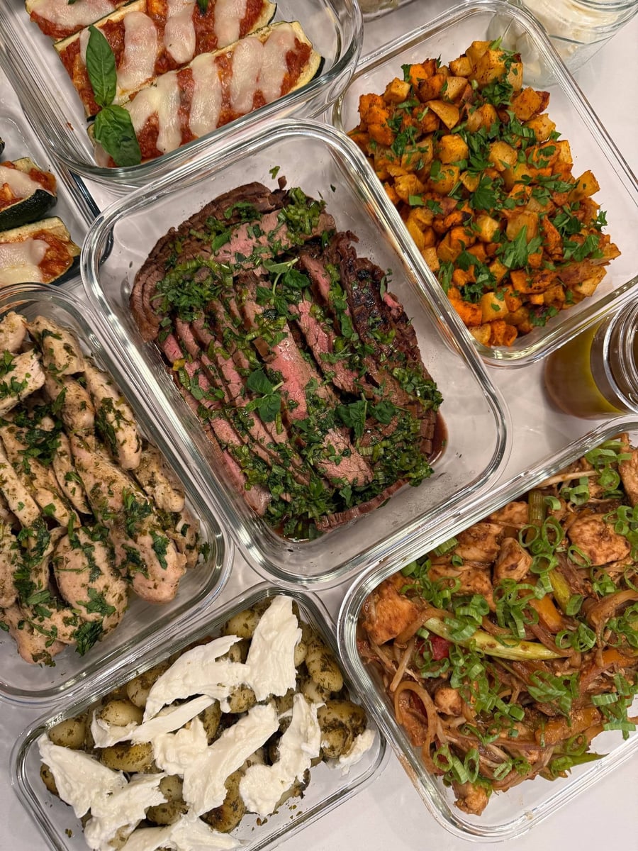 Chopped herbs blanket the vietnamese flank steak, pad thai noodles and pesto gnocchi at its shoulders.